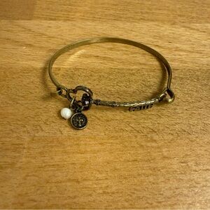Antique gold tone rigid bracelet with key spelling faith